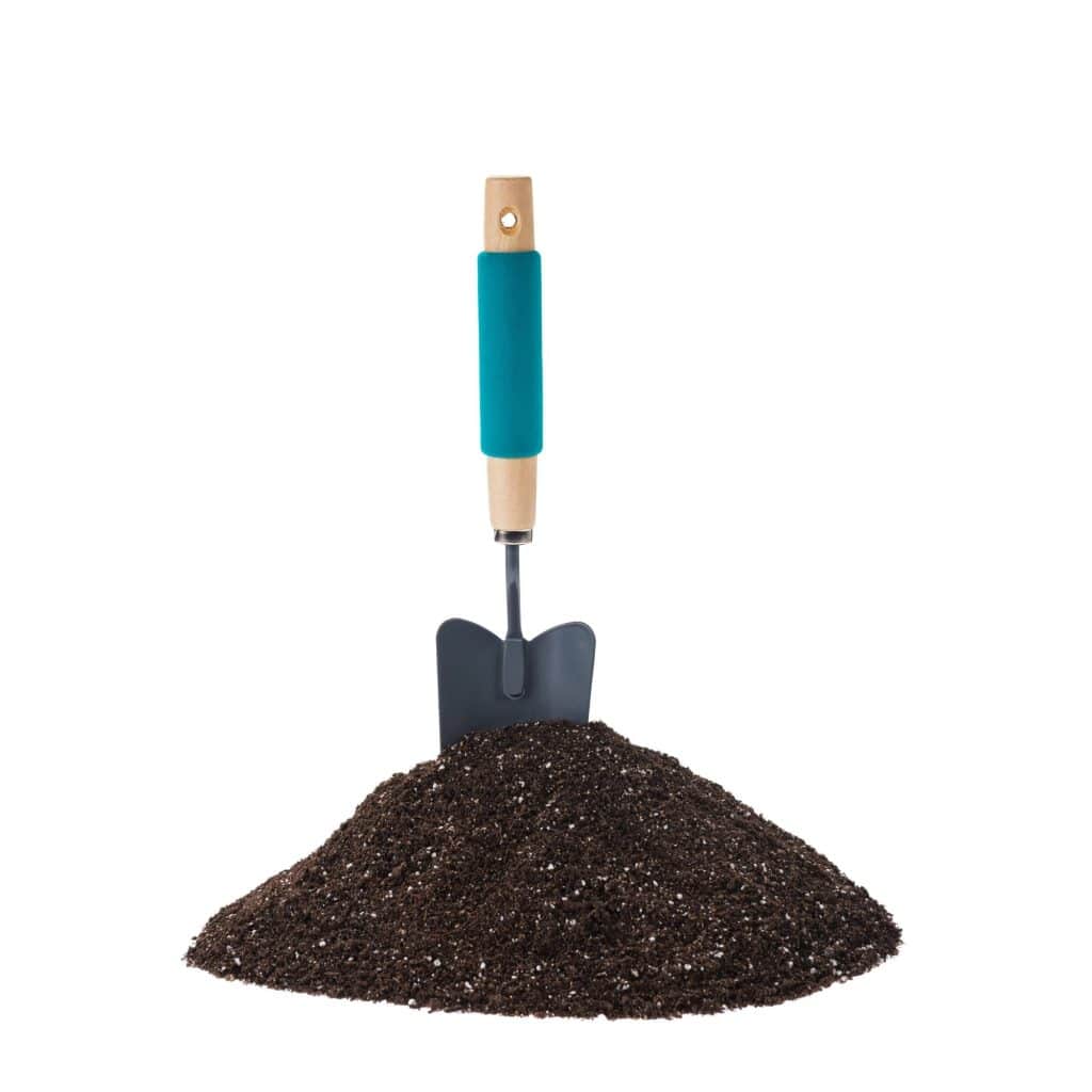 A mound of potting mix and a spade